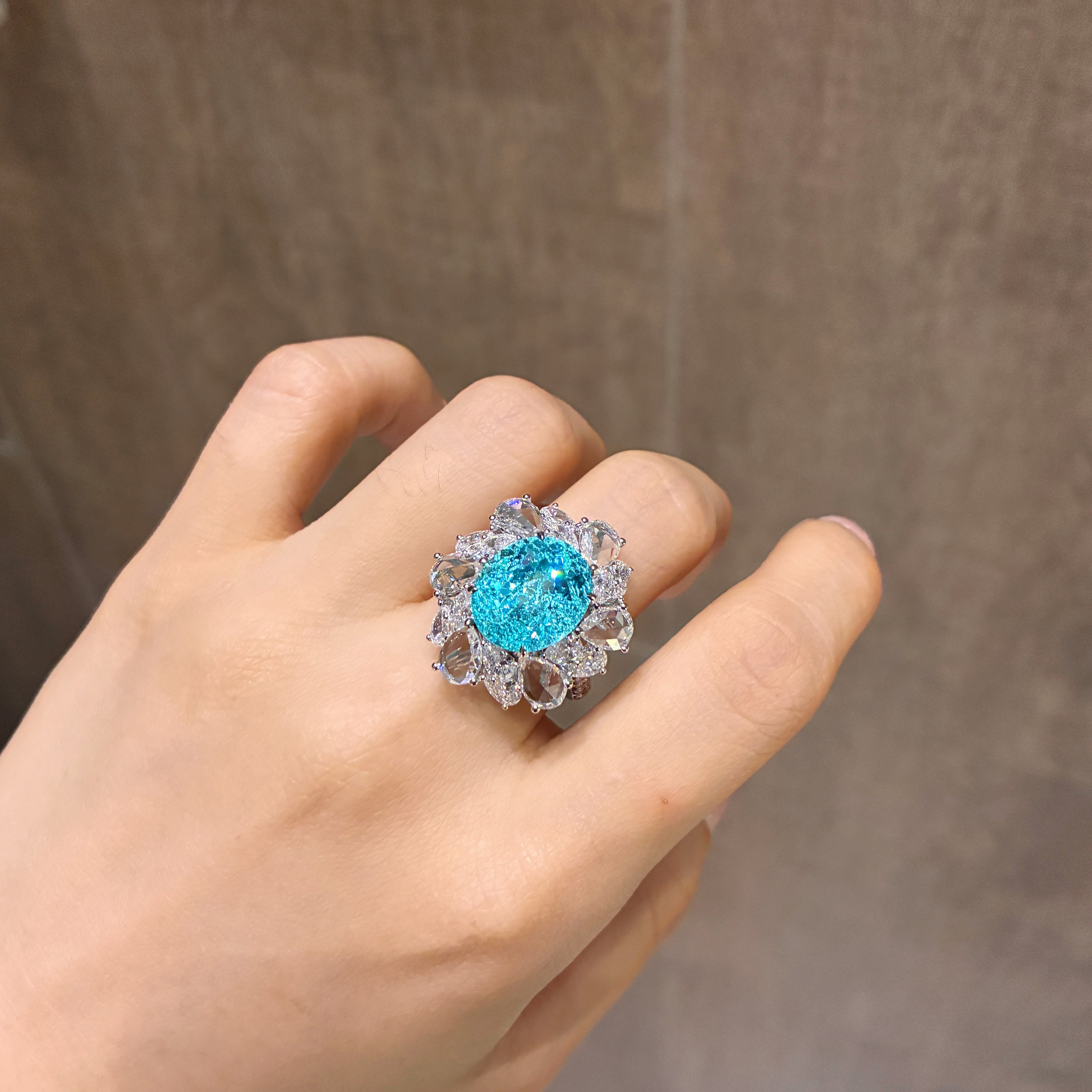 12.71 Carat Lab Neon Blue Paraiba 18K Gold Graduated Pear Ring